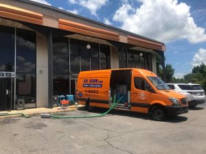 Water Damage Restoration Team At A Commercial Job Site