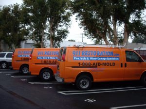 911 Restoration Crew Parked At A Commercial Job Site