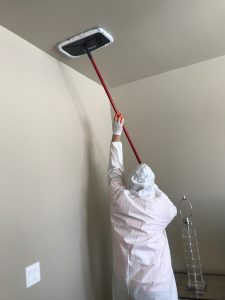 A Technician Conducting The Final Touches Of Water Damage Cleanup