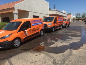 Water Damage Restoration Fleet At A Commercial Job Site