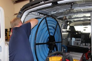 A Technician Prepping Water Extraction Equipment